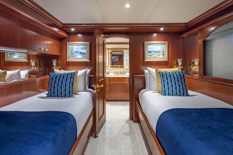 Slide: The Image of Luxurious twin cabin on 2001 TRINITY Tri-Deck MY yacht with elegant wood paneling. - 18