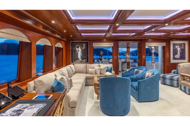 Slide: The Image of Luxurious interior of 2001 TRINITY Tri-Deck MY yacht with elegant seating and decor. - 24