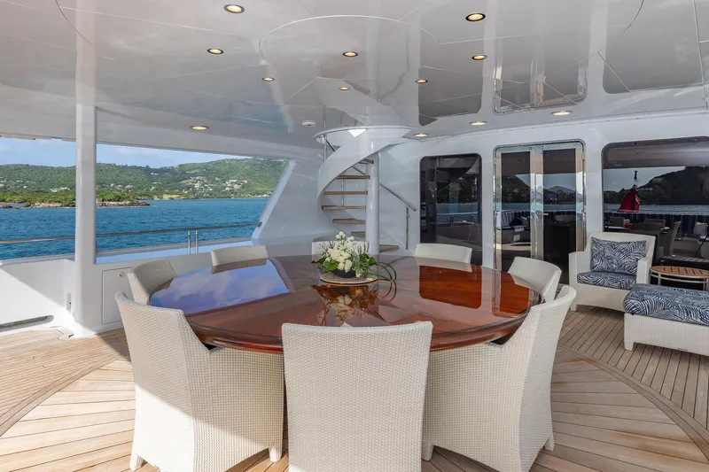 Slide: The Image of Luxurious 2001 TRINITY Tri-Deck MY yacht deck with elegant dining area and scenic ocean view. - 28