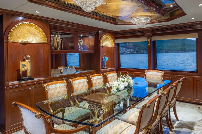 Slide: The Image of Luxurious dining area on 2001 TRINITY Tri-Deck MY yacht with elegant decor and sea view. - 4