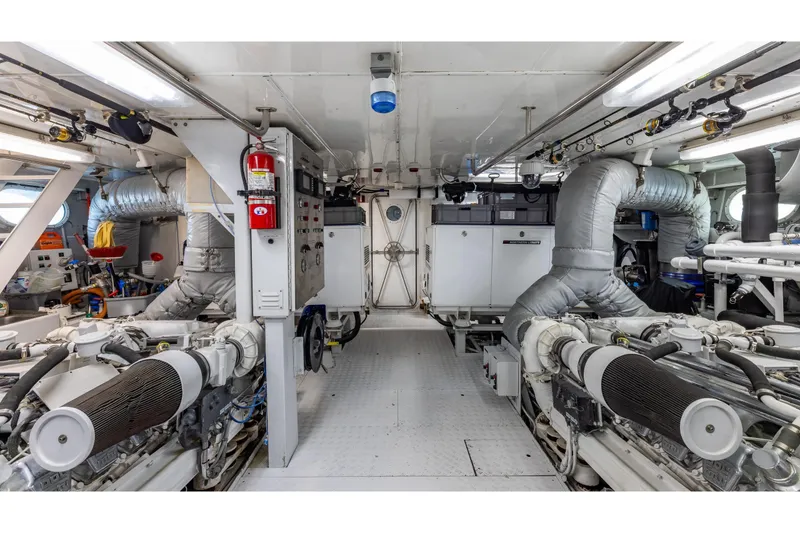 Slide: The Image of Engine room of 2001 TRINITY Tri-Deck MY yacht, featuring advanced machinery and equipment. - 43