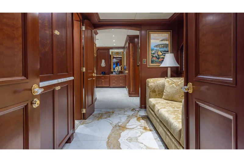 Slide: The Image of Luxurious interior of 2001 TRINITY Tri-Deck MY yacht with elegant wood paneling and marble flooring. - 5
