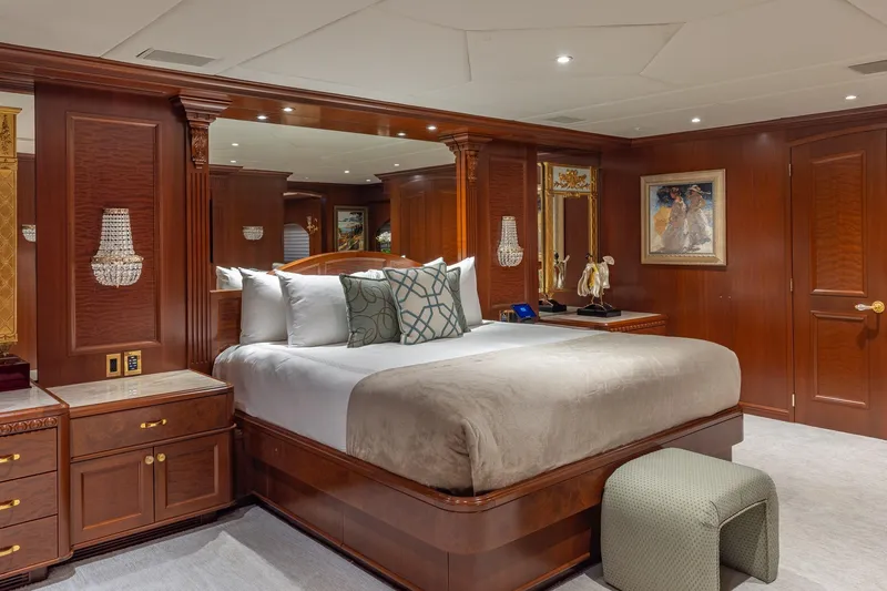 Slide: The Image of Luxurious bedroom on 2001 TRINITY Tri-Deck MY yacht with elegant wood paneling. - 6