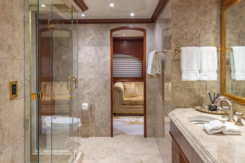Slide: The Image of Luxurious bathroom on 2001 TRINITY Tri-Deck MY yacht with marble and gold accents. - 9