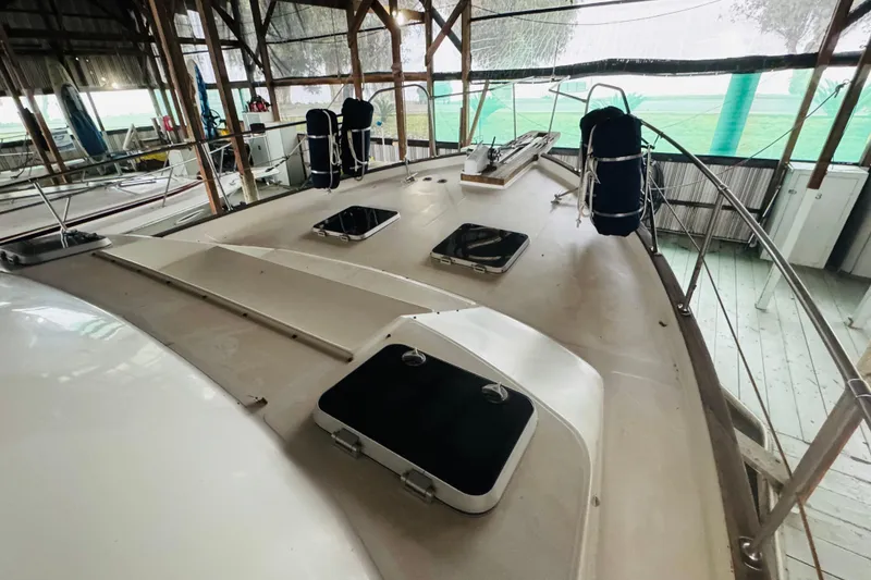Slide: The Image of 1987 Bayliner 4550 Motoryacht deck view in covered marina setting. - 11