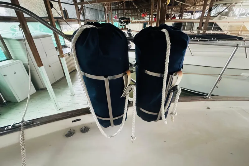 Slide: The Image of Two blue fenders on a 1987 Bayliner 4550 Motoryacht deck. - 15