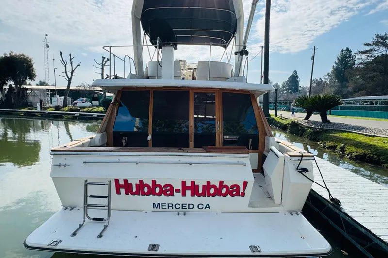 Slide: The Image of 1987 Bayliner 4550 Motoryacht docked, rear view with "Hubba-Hubba!" text, Merced, CA. - 17