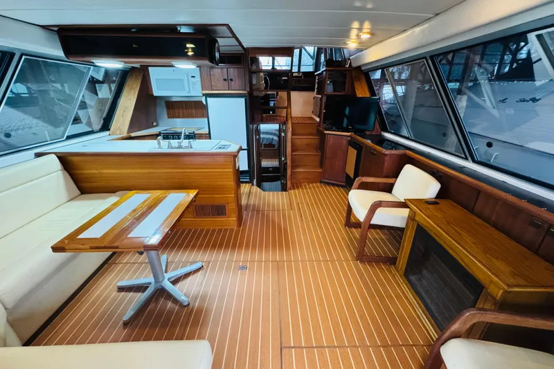 Slide: The Image of Interior of 1987 Bayliner 4550 Motoryacht with wood accents and modern furnishings. - 35