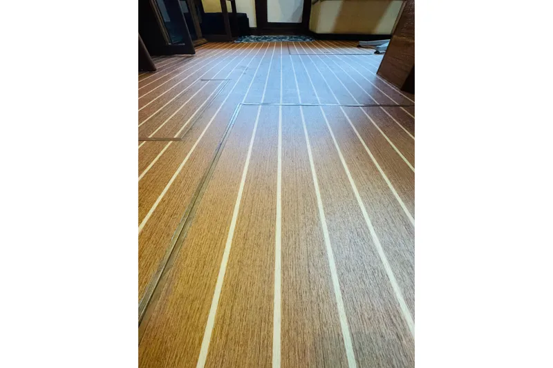 Slide: The Image of 1987 Bayliner 4550 Motoryacht interior with sleek wooden flooring design. - 39