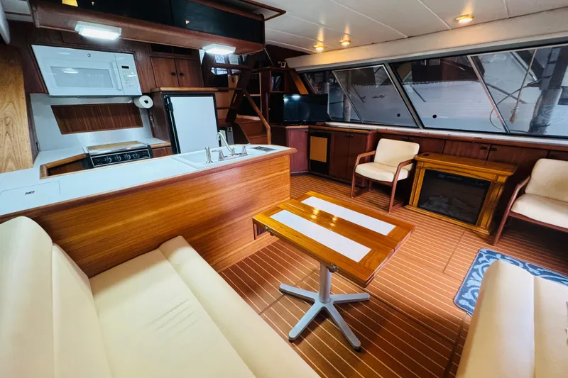 Slide: The Image of Interior of 1987 Bayliner 4550 Motoryacht with modern kitchen and cozy seating area. - 40
