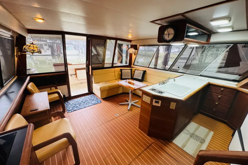 Slide: The Image of Interior of 1987 Bayliner 4550 Motoryacht with cozy seating and modern kitchen area. - 41