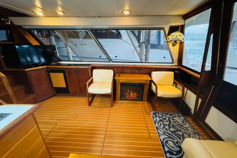 Slide: The Image of Interior of 1987 Bayliner 4550 Motoryacht with cozy seating and elegant wood finish. - 42