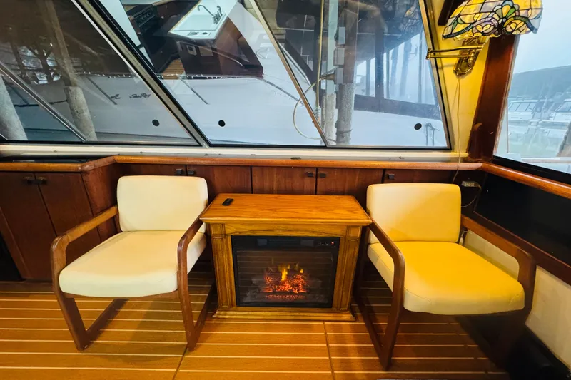 Slide: The Image of Interior of 1987 Bayliner 4550 Motoryacht with cozy seating and electric fireplace. - 43