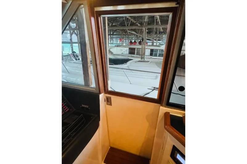 Slide: The Image of Interior view of 1987 Bayliner 4550 Motoryacht, showcasing window and control panel. - 56