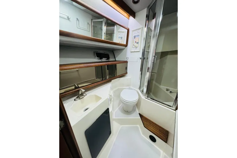 Slide: The Image of Bathroom interior of 1987 Bayliner 4550 Motoryacht with sink, toilet, and shower. - 76