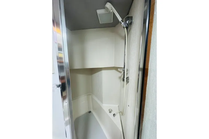 Slide: The Image of Shower area in 1987 Bayliner 4550 Motoryacht, featuring modern fixtures and compact design. - 77