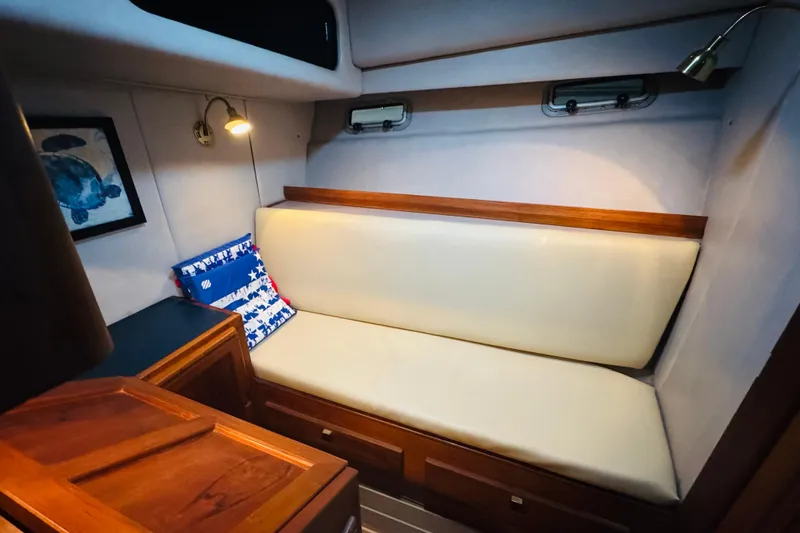 Slide: The Image of 1987 Bayliner 4550 Motoryacht interior with cushioned seating and nautical decor. - 81
