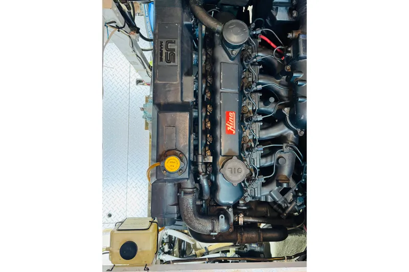 Slide: The Image of Engine of 1987 Bayliner 4550 Motoryacht, featuring a Hino marine diesel engine. - 84