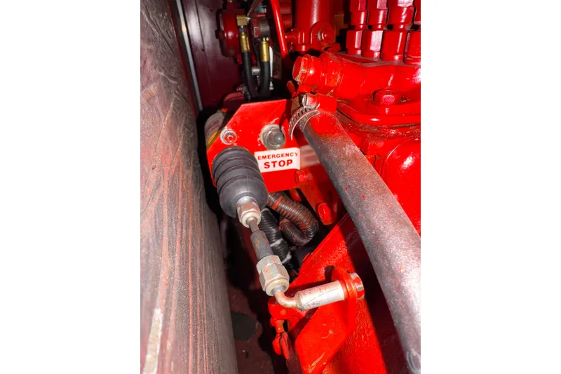 Slide: The Image of Engine compartment of 1987 Bayliner 4550 Motoryacht with emergency stop button. - 98