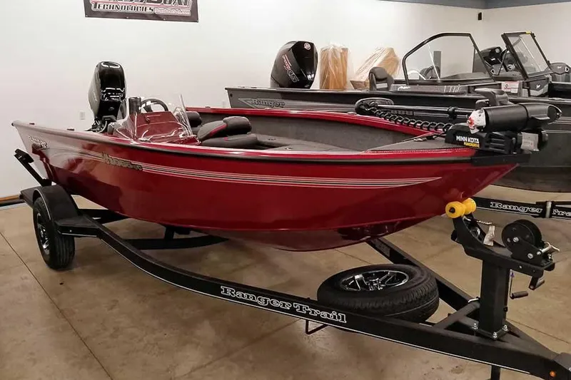 The Image of 2026 Ranger Aluminum VS1665 SC boat in showroom, red finish, on trailer. - 1