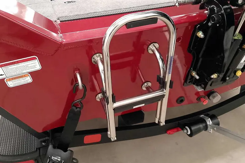 Slide: The Image of 2026 Ranger Aluminum VS1665 SC boat with red exterior and stainless steel ladder. - 11