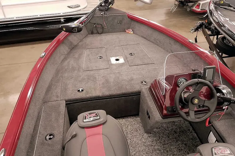 Slide: The Image of 2026 Ranger Aluminum VS1665 SC boat interior with steering console and seating. - 12