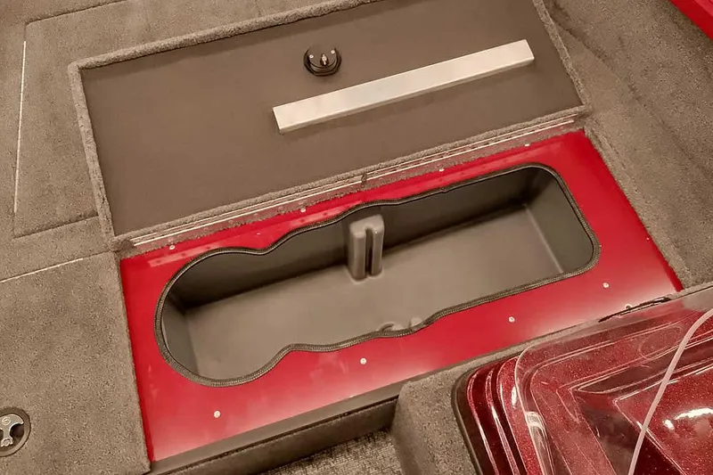 Slide: The Image of 2026 Ranger Aluminum VS1665 SC boat storage compartment with red trim and gray interior. - 13