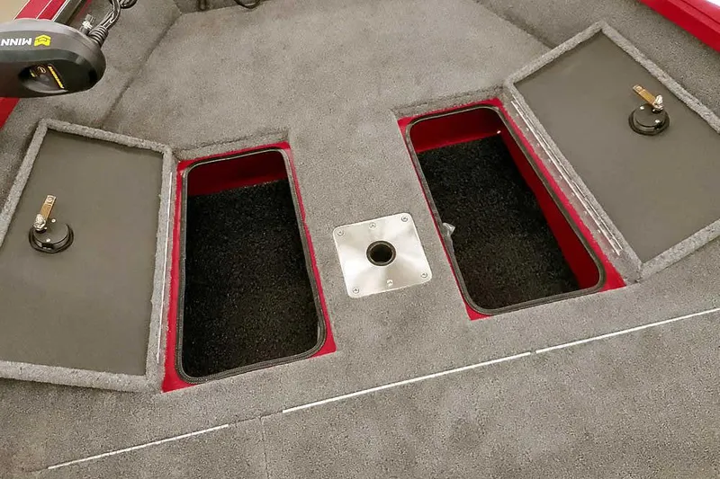 Slide: The Image of 2026 Ranger Aluminum VS1665 SC boat storage compartments with carpeted interior. - 16