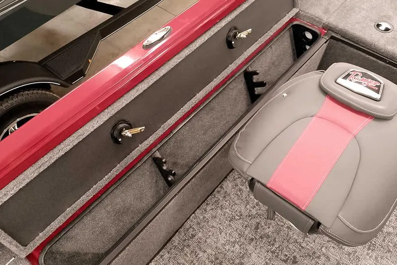 Slide: The Image of 2026 Ranger Aluminum VS1665 SC boat interior with storage compartments and branded seat. - 18