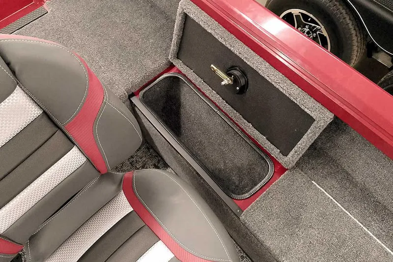 Slide: The Image of 2026 Ranger Aluminum VS1665 SC boat interior with storage compartment and cushioned seats. - 19