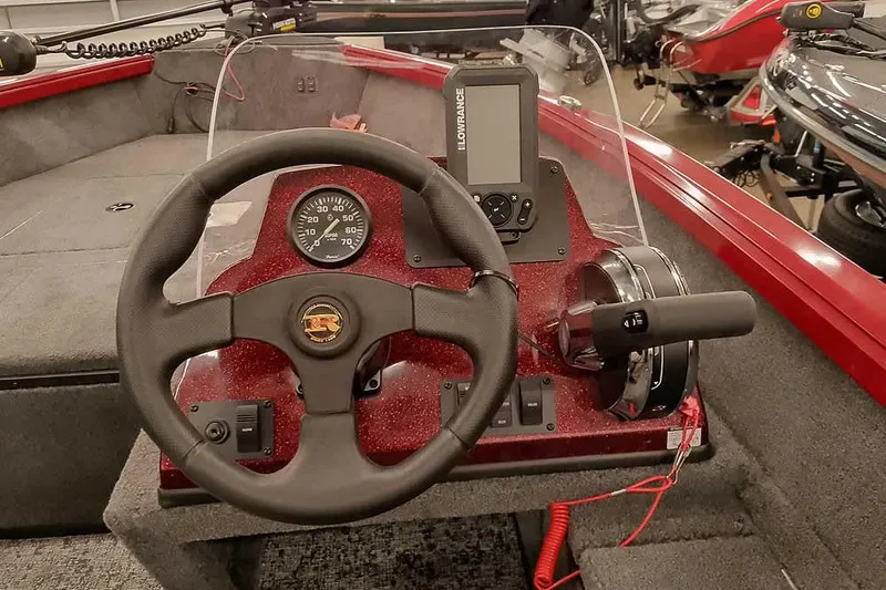 Slide: The Image of 2026 Ranger Aluminum VS1665 SC boat dashboard with steering wheel and control panel. - 22