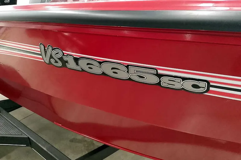 Slide: The Image of Red 2026 Ranger Aluminum VS1665 SC boat with bold model lettering. - 5