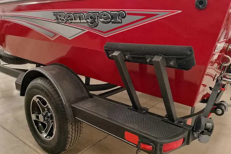 Slide: The Image of Red 2026 Ranger Aluminum VS1665 SC boat on trailer, showcasing sleek design and branding. - 9