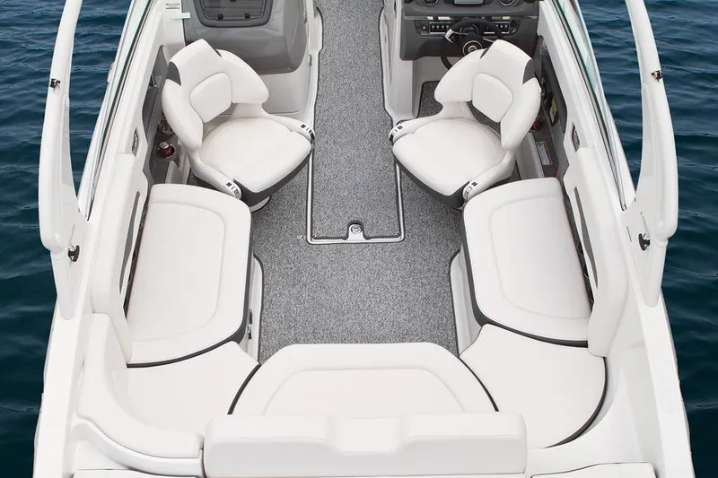 Slide: The Image of Manufacturer Provided Image: 2015 Chaparral 246 SSi boat interior with white seating and gray flooring. - 11