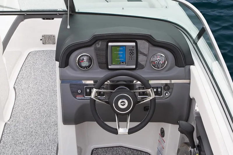 Slide: The Image of Manufacturer Provided Image: 2015 Chaparral 246 SSi boat dashboard with steering wheel and navigation display. - 12