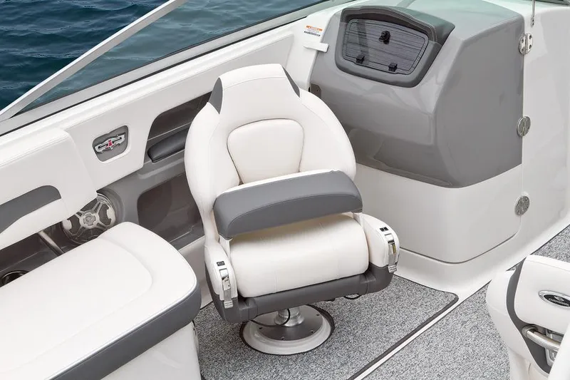 Slide: The Image of Manufacturer Provided Image: Captain's seat and dashboard of a 2015 Chaparral 246 SSi boat. - 13