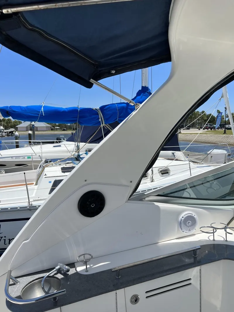 Slide: The Image of 2012 Sea Ray Sundancer yacht docked at marina, featuring sleek design and modern amenities. - 22