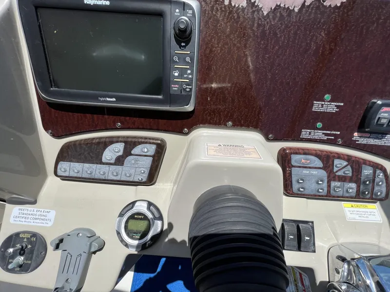 Slide: The Image of Control panel of a 2012 Sea Ray Sundancer boat with navigation equipment. - 26