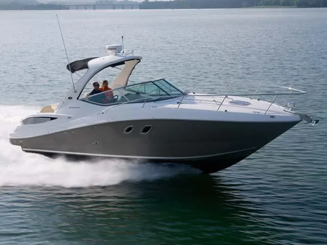 Slide: The Image of 2012 Sea Ray Sundancer cruising on a calm lake. - 4