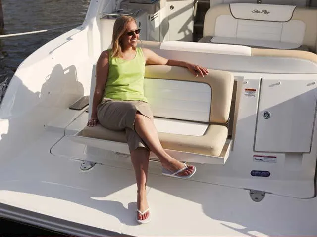 Slide: The Image of Woman relaxing on a 2012 Sea Ray Sundancer boat, enjoying the sun. - 6