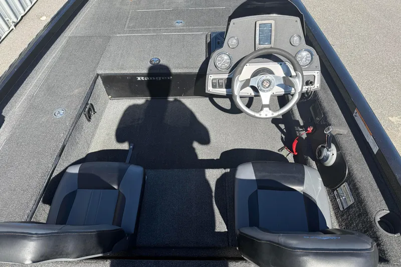 Slide: The Image of 2015 Ranger RT178C boat interior with steering wheel and seats, shadow visible. - 5