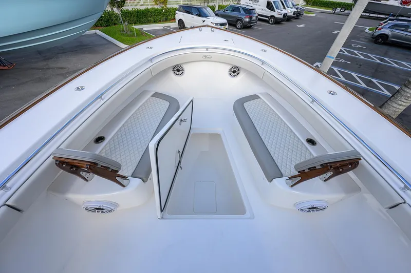 Slide: The Image of 2025 Valhalla Boatworks V-41 interior with cushioned seating and storage compartments. - 16