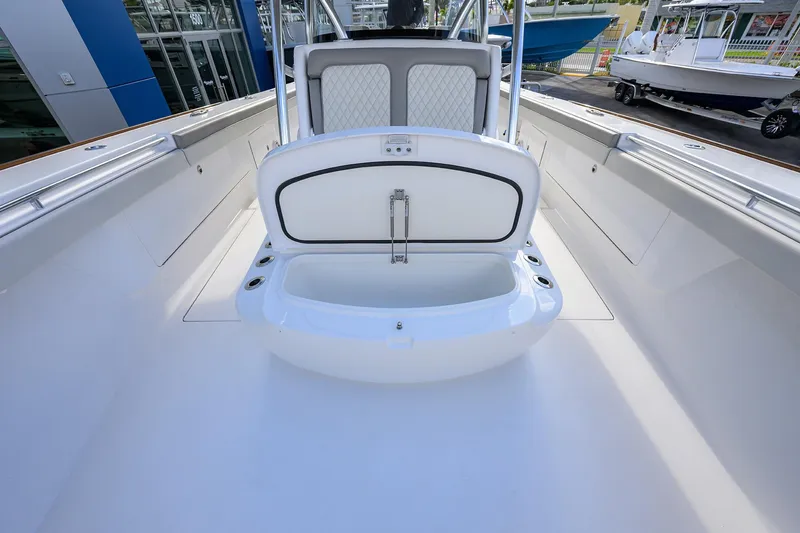 Slide: The Image of 2025 Valhalla Boatworks V-41 interior with open storage compartment, showcasing sleek design. - 21