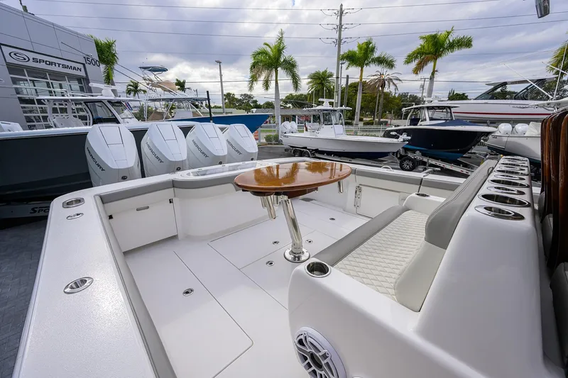 Slide: The Image of 2025 Valhalla Boatworks V-41 with spacious deck, seating, and modern design in marina setting. - 24