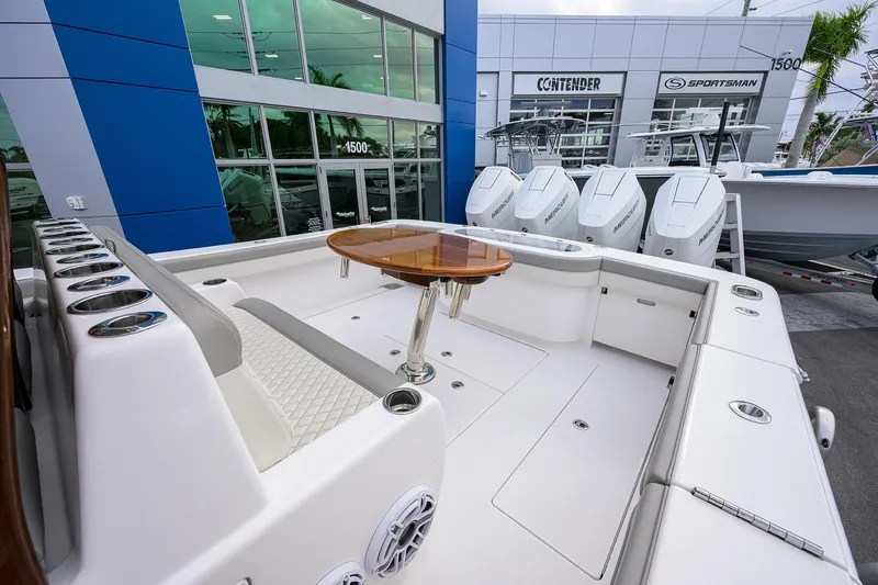 Slide: The Image of 2025 Valhalla Boatworks V-41 luxury boat interior with seating and table, displayed at dealership. - 27