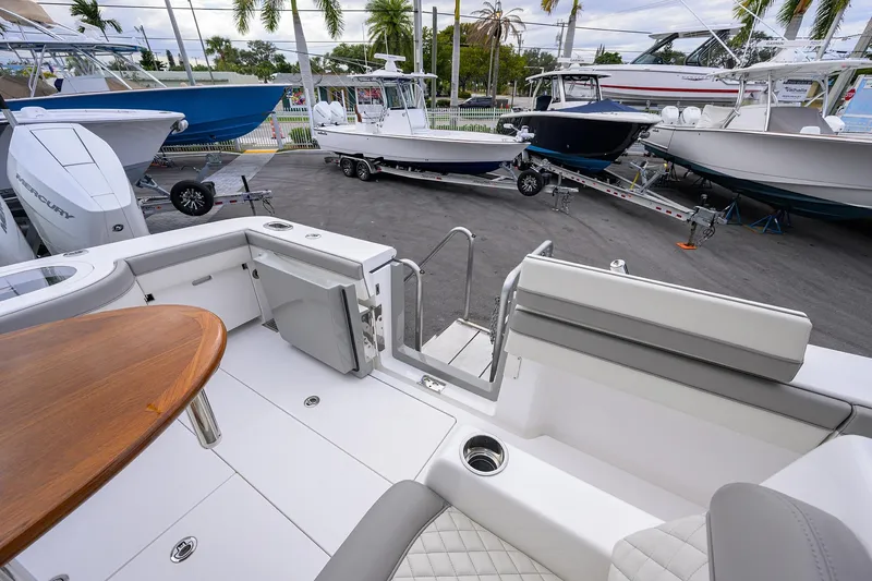 Slide: The Image of 2025 Valhalla Boatworks V-41 interior with seating and table, surrounded by other boats. - 29