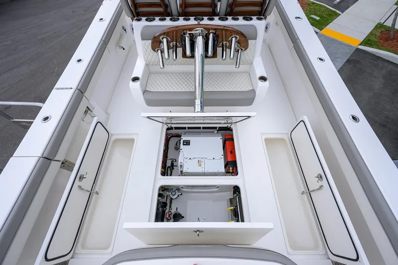Slide: The Image of 2025 Valhalla Boatworks V-41 interior with open storage compartments and seating area. - 34