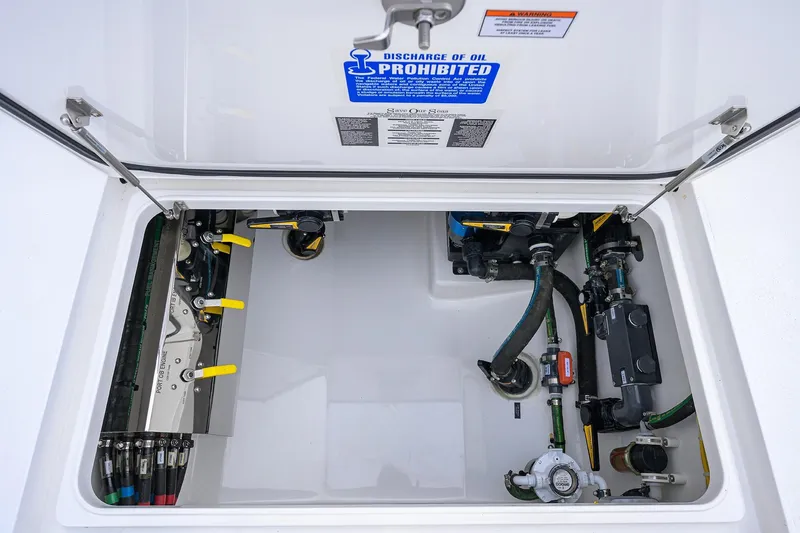 Slide: The Image of 2025 Valhalla Boatworks V-41 engine compartment with visible hoses and components. - 37