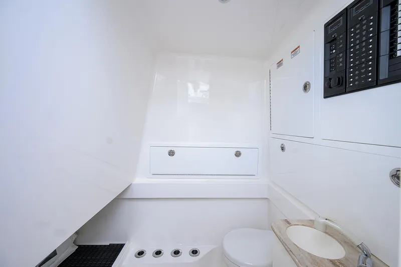 Slide: The Image of 2025 Valhalla Boatworks V-41 interior bathroom with modern fixtures and control panels. - 38