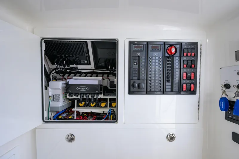Slide: The Image of 2025 Valhalla Boatworks V-41 electrical panel with Garmin equipment and control switches. - 40